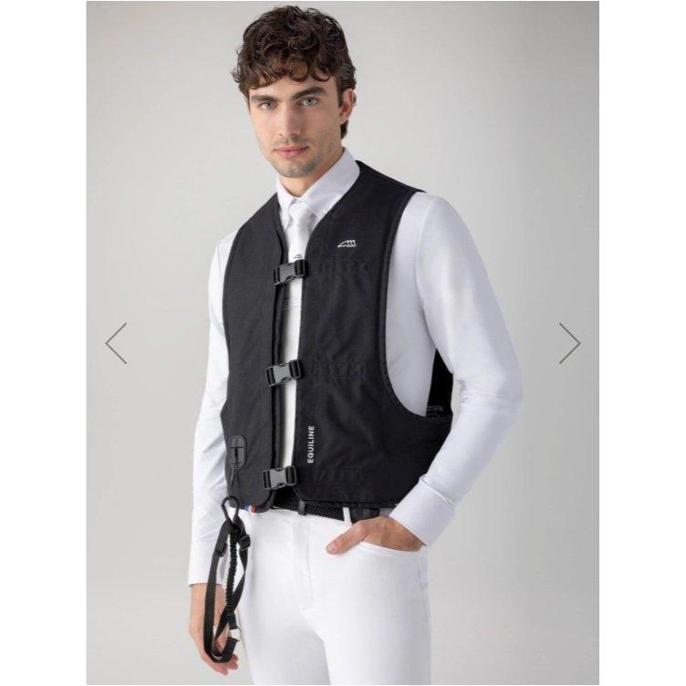 Equestrian rider wearing the protective Oxair Airbag Vest, designed for cross-country and eventing