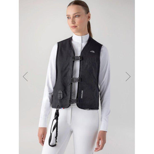 Equestrian rider wearing the unisex protective Oxair Airbag Vest, designed for cross-country and eventing